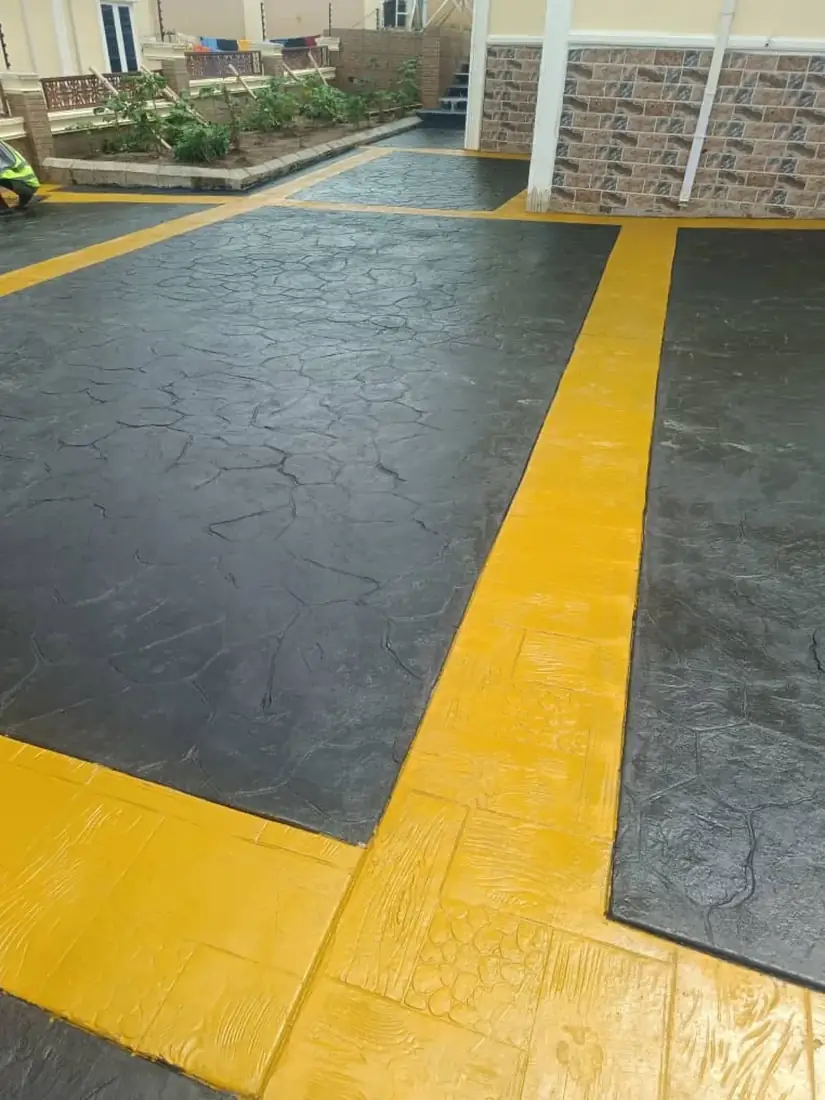 Black stamped stone pattern with yellow bands in Ado Ekiti
