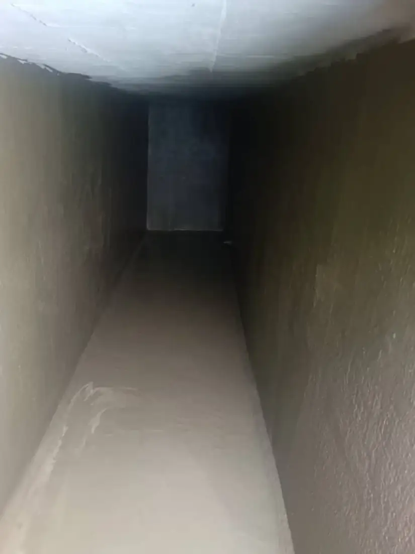 Waterproofed below-grade concrete corridor